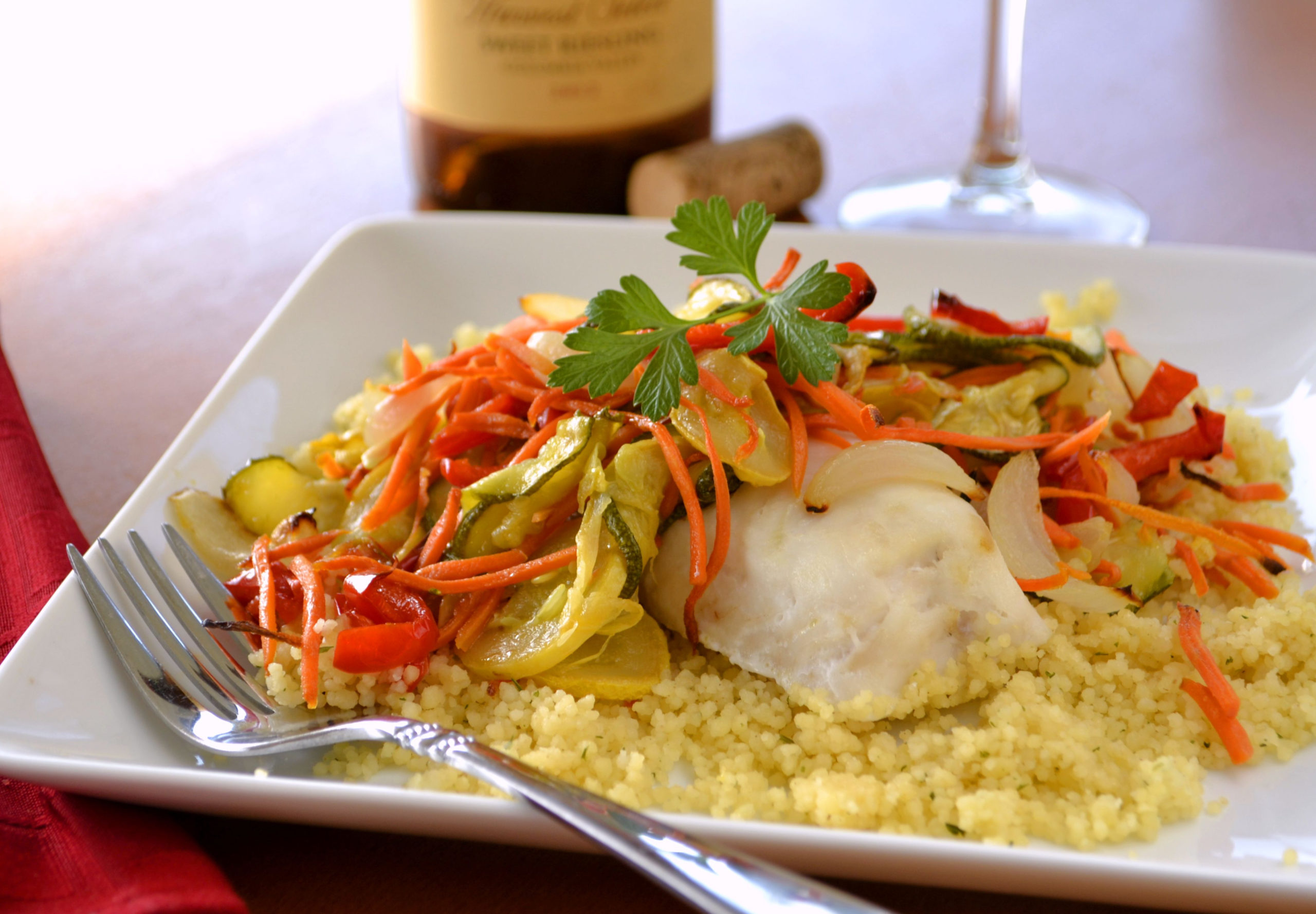 ahealthymealofbakedfishwithovenroastedvegetablesovercouscous